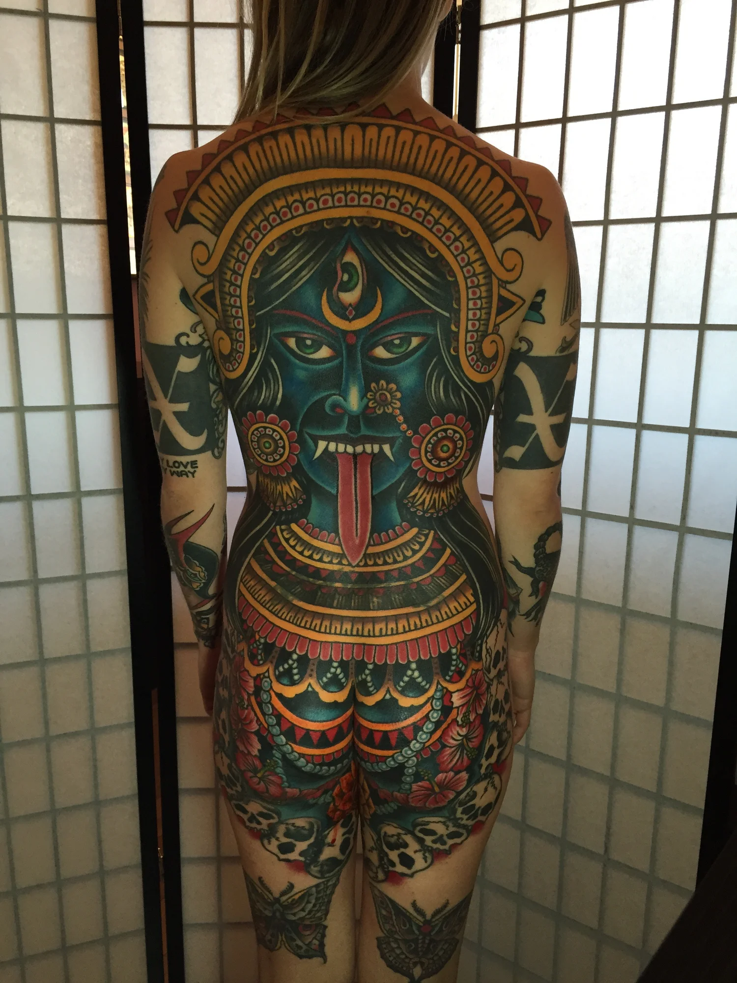 Full back traditional tattoo by Adventure Tattoo